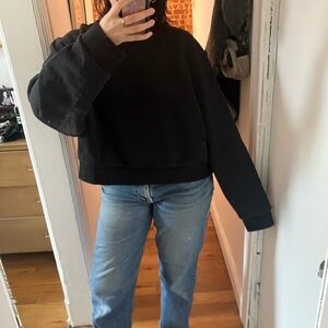 Black Sweatshirt and Blue Jeans